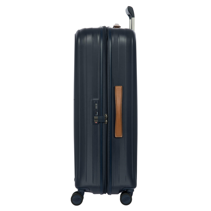 Zijkant van de Bric's Taormina grote koffer in navy #kleur_navy