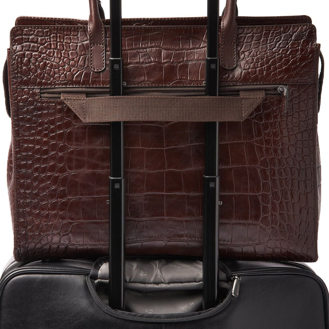 De Castelijn en Beerens Tess dames werktas in croco cognac op een koffer #kleur_croco-cognac