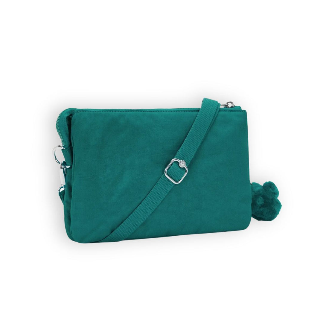 Achterkant van de Kipling RIRI Outspoken green #kleur_outspoken-green
