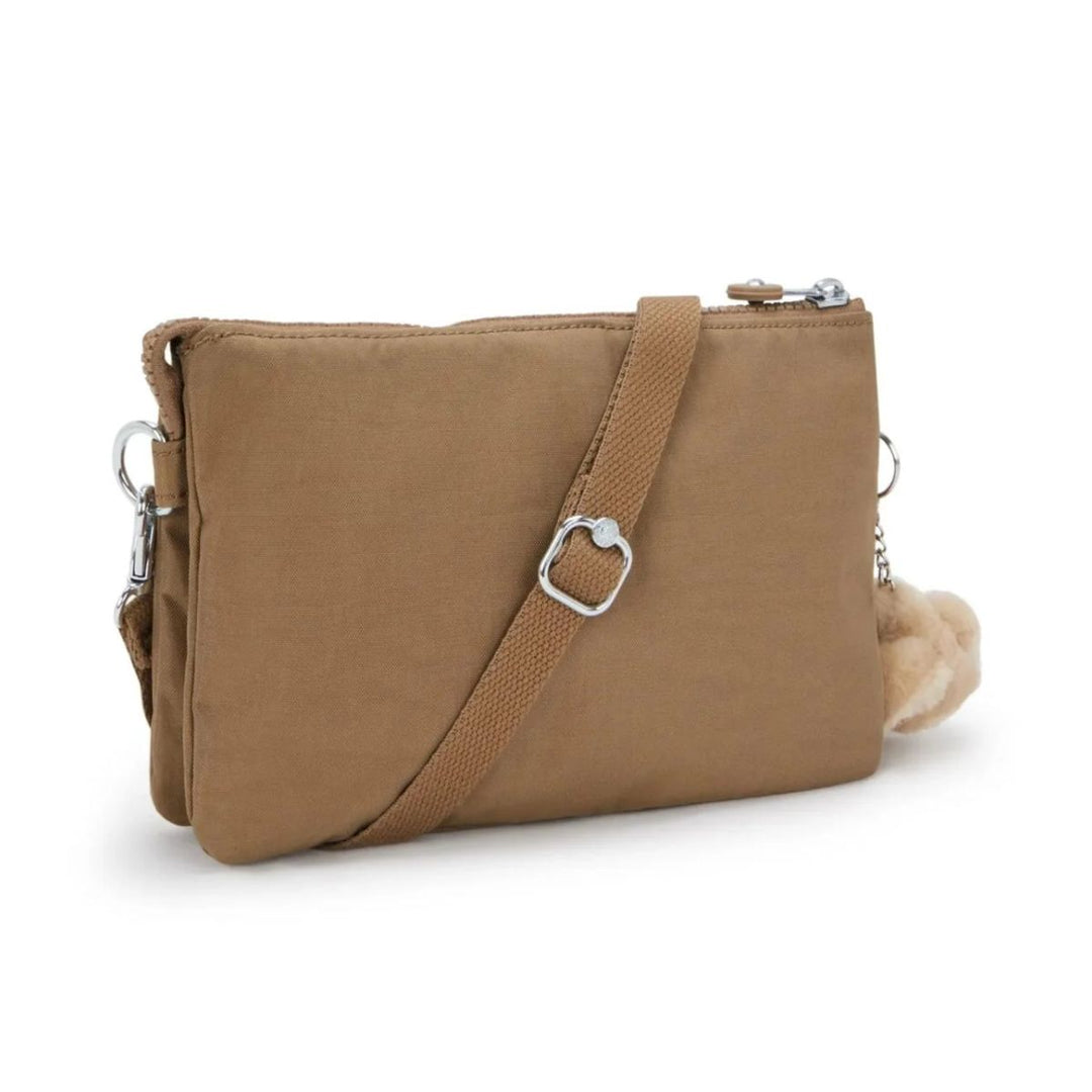 Achterkant van de Kipling RIRI Crossover tas early-tan #kleur_early-tan