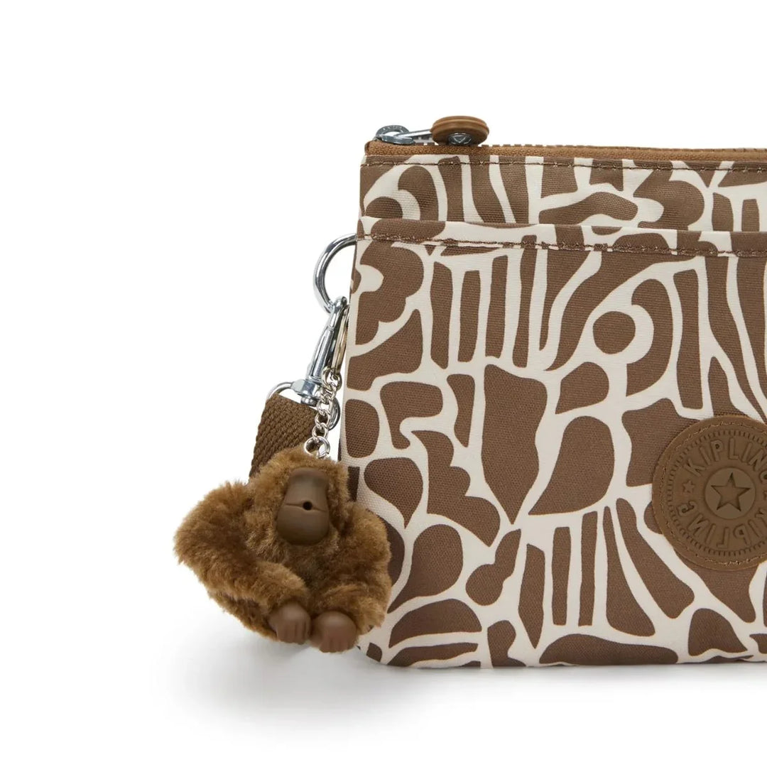Details van het kipling aapje #kleur_cocktail-khaki