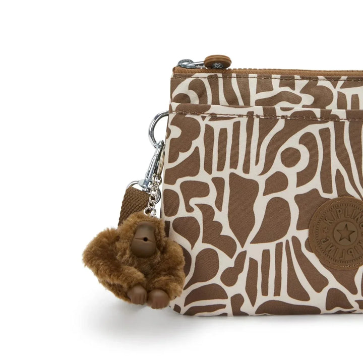 Details van het kipling aapje #kleur_cocktail-khaki